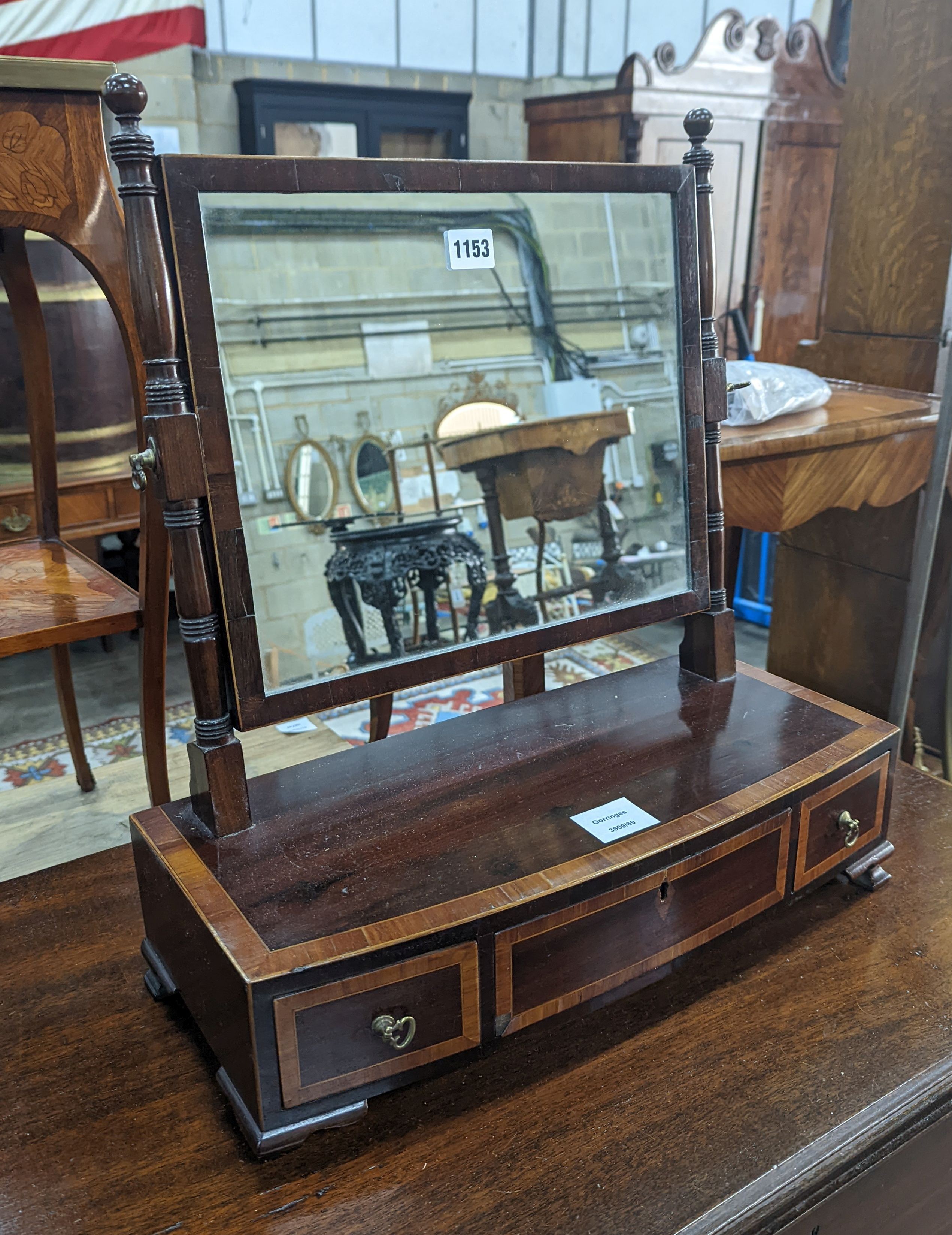 A Regency satinwood banded mahogany bow fronted toilet mirror, width 46cm, height 51cm